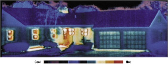Thermal photograph of ranch style house shows heat escaping through windows, doors, and front porch.