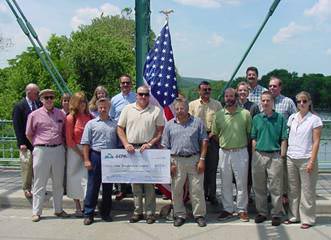 group photo of partners with big check